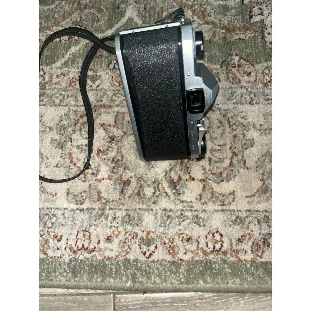 Vintage Honeywell Pentax 35 Mm Camera Features A Classic Silver And Black Finish